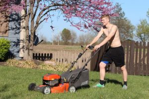 A lawn mower in use. But Is Mowing a Good Workout?