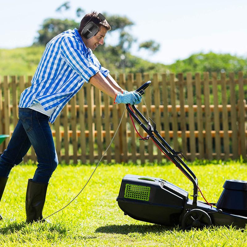 Image of a lawn mower in use. But, Should You Wear Ear Protection While Mowing?